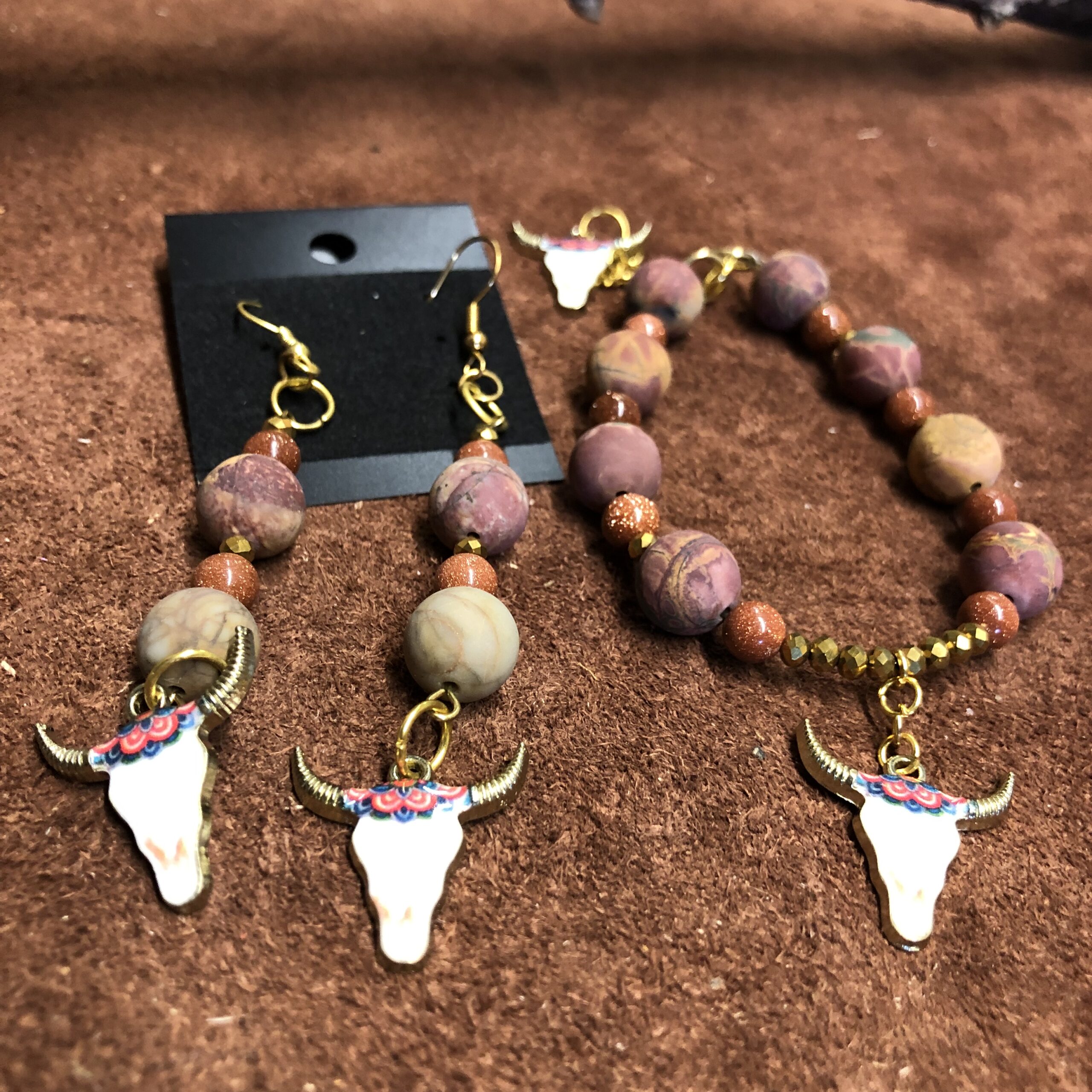 Red Picasso Jasper with Gold Faceted, Glittery beads and Gold Enameled Cow Skull Charms Bracelet and Earrings