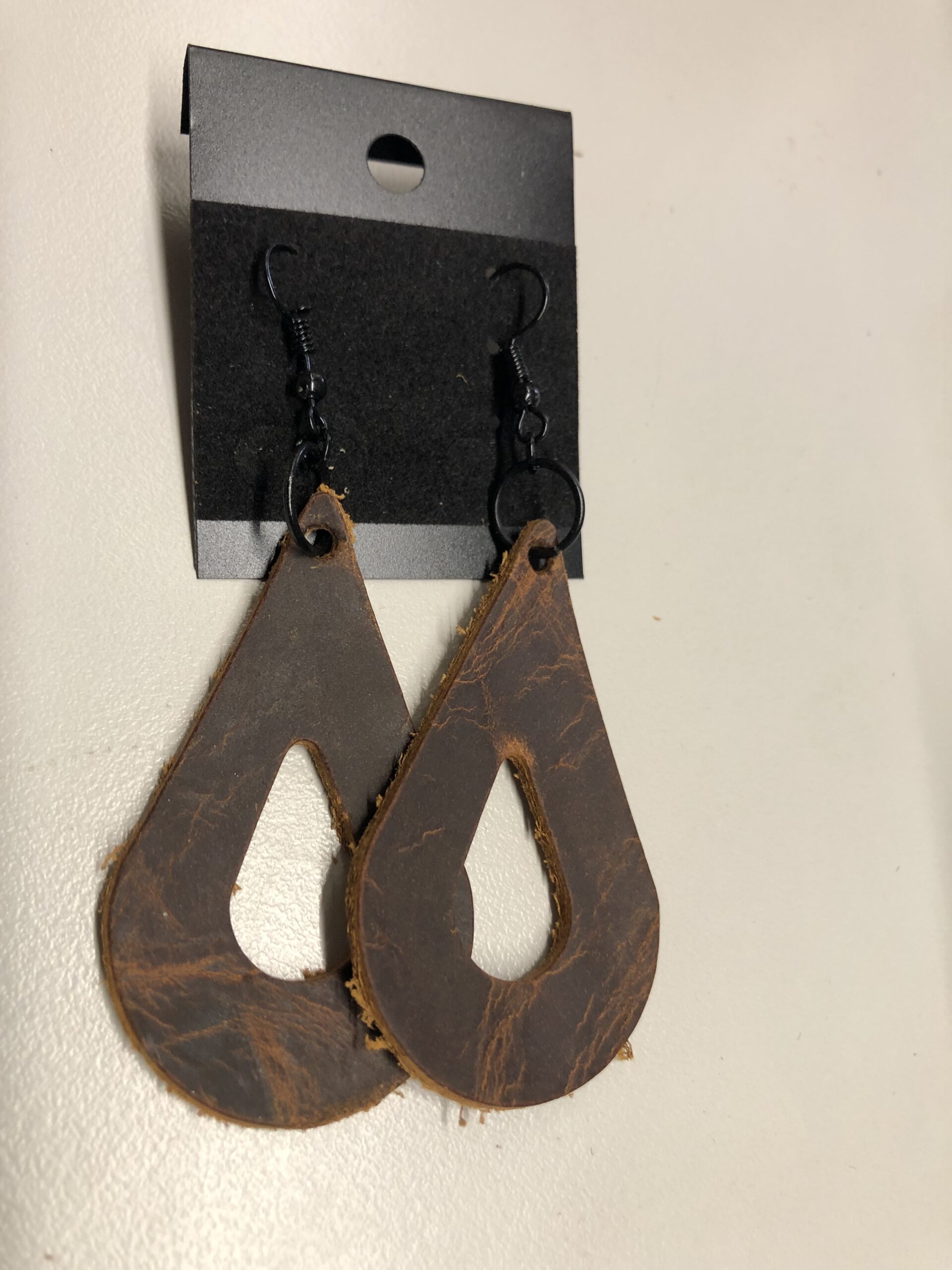 Real Distressed Leather Teardrop Earrings on Black ear wires