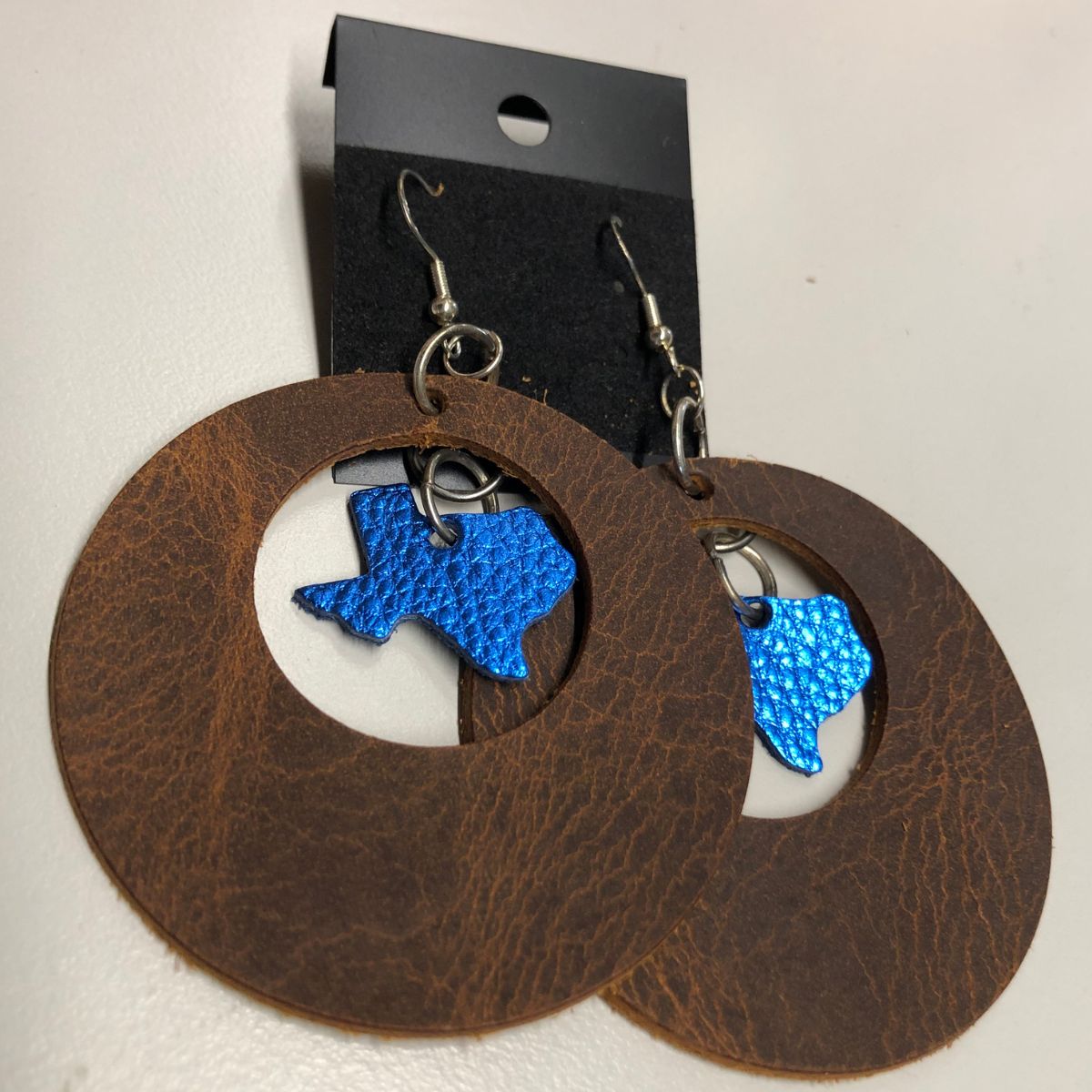 Distressed Leather Wide Circle Cutout Earrings with Real Blue Pebbled Leather Texas Charms on Silver Ear Wires