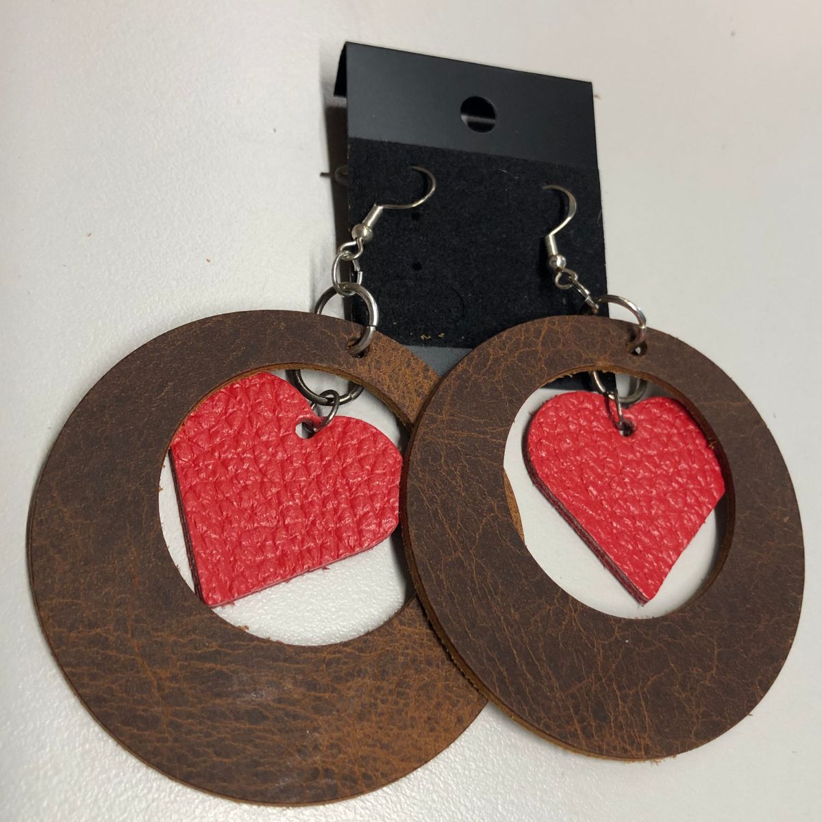 Distressed Leather Wide Circle Cutout Earrings with Real Red Pebbled Leather Heart Charms on Silver Ear Wires
