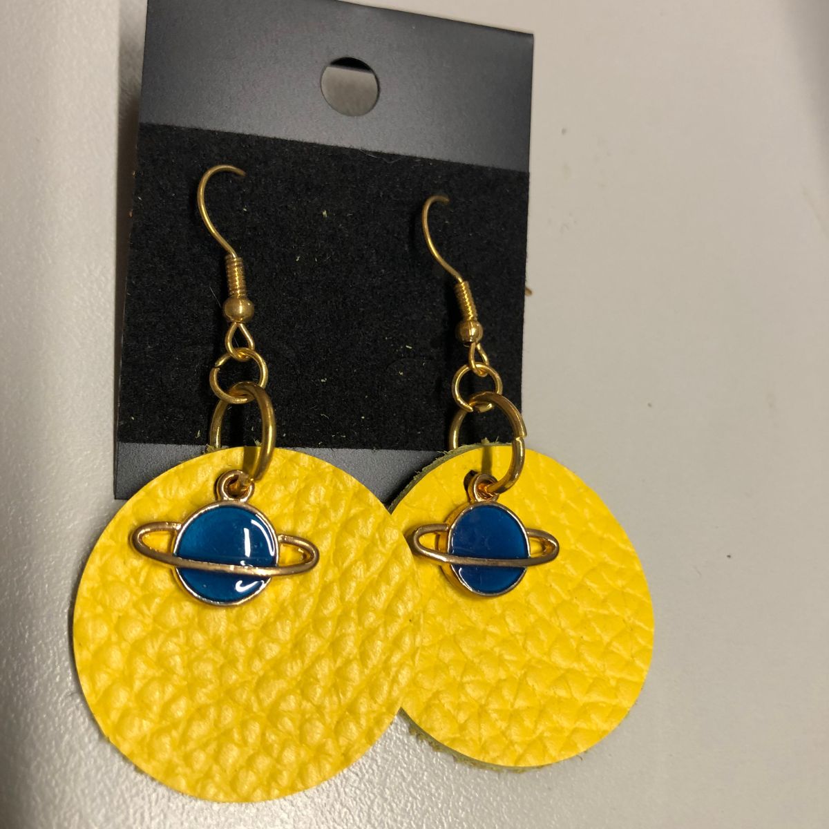 Real Yellow Pebbled Leather Earrings on Gold Ear wires with Blue Enameled Saturn Charms
