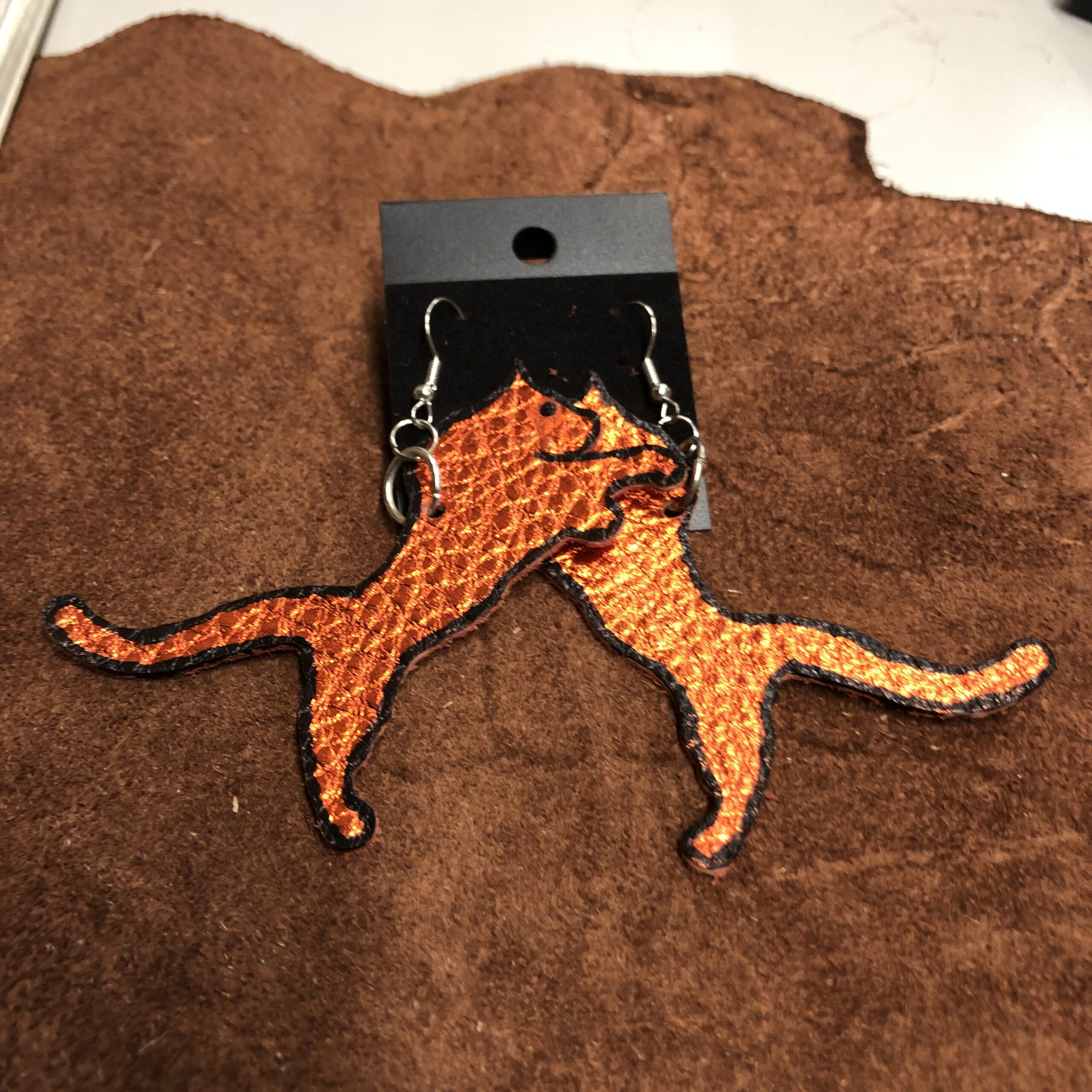 Real Shiny Orange Leather Panther cutout Earrings on Silver Ear Wires