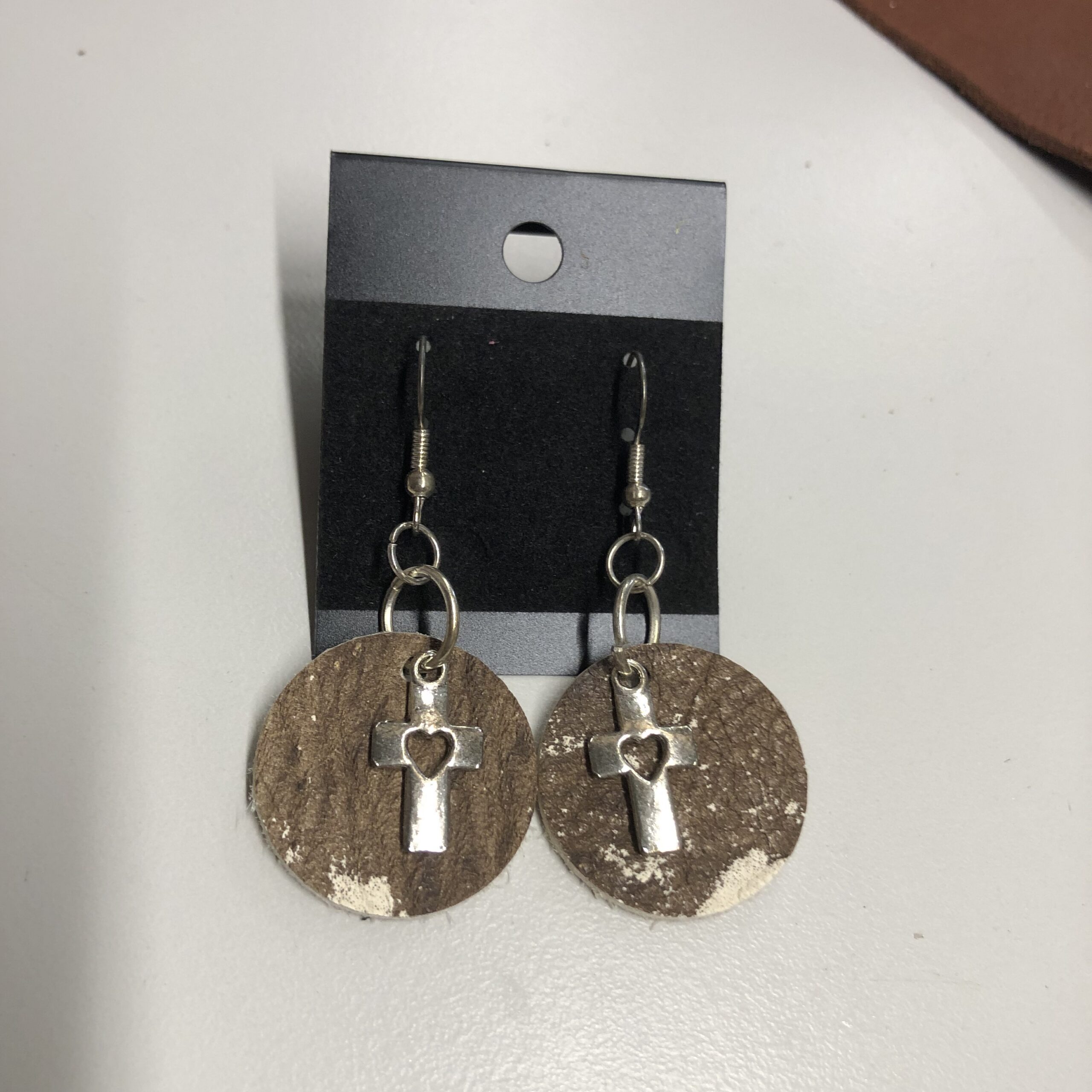 Real Brown & White Cowhide 1inch Round Earrings with Silver Heart Cutout Cross Charm on Silver Ear Wires