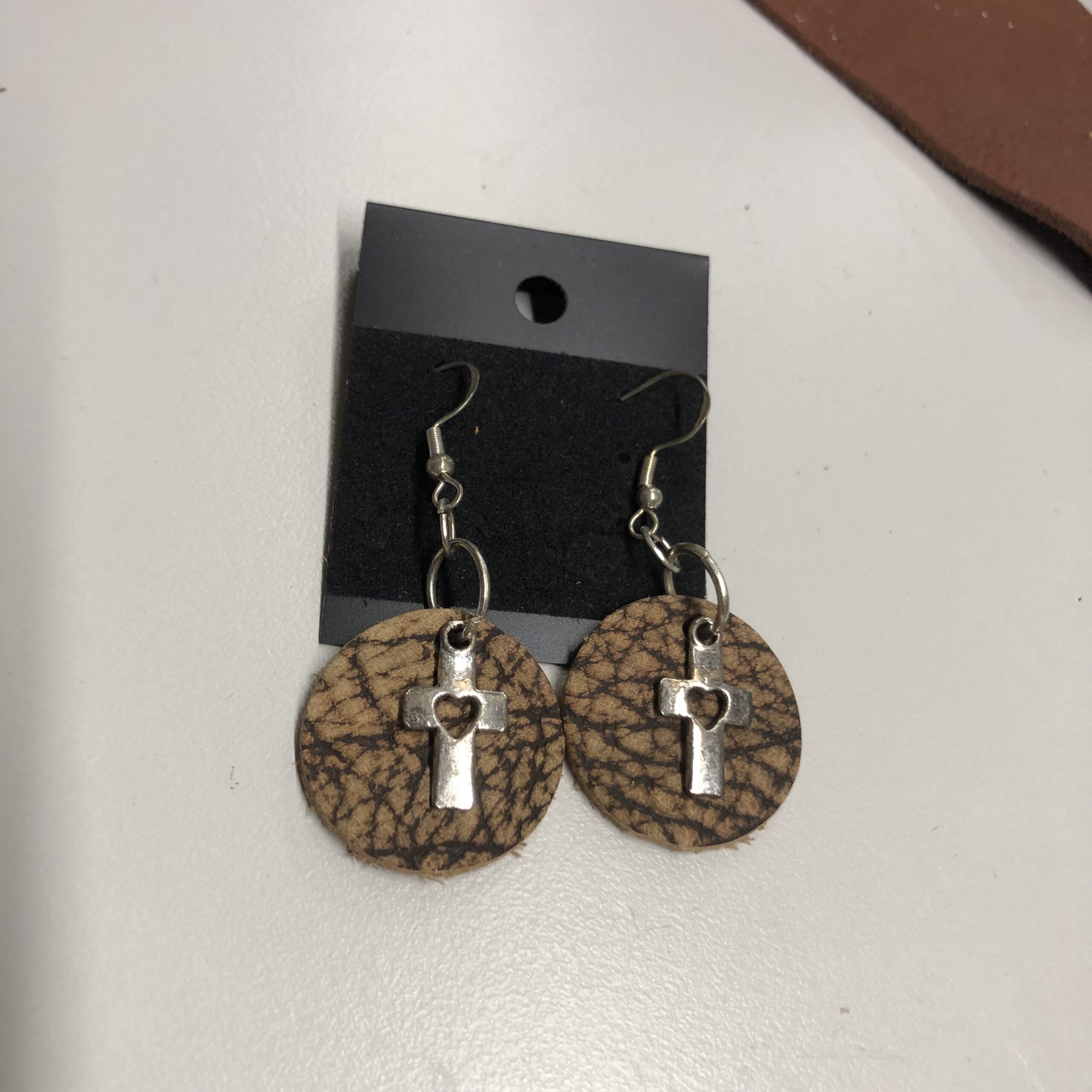 Real Bison Hide 1inch Round Earrings with Silver Heart Cutout Cross Charm on Silver Ear Wires