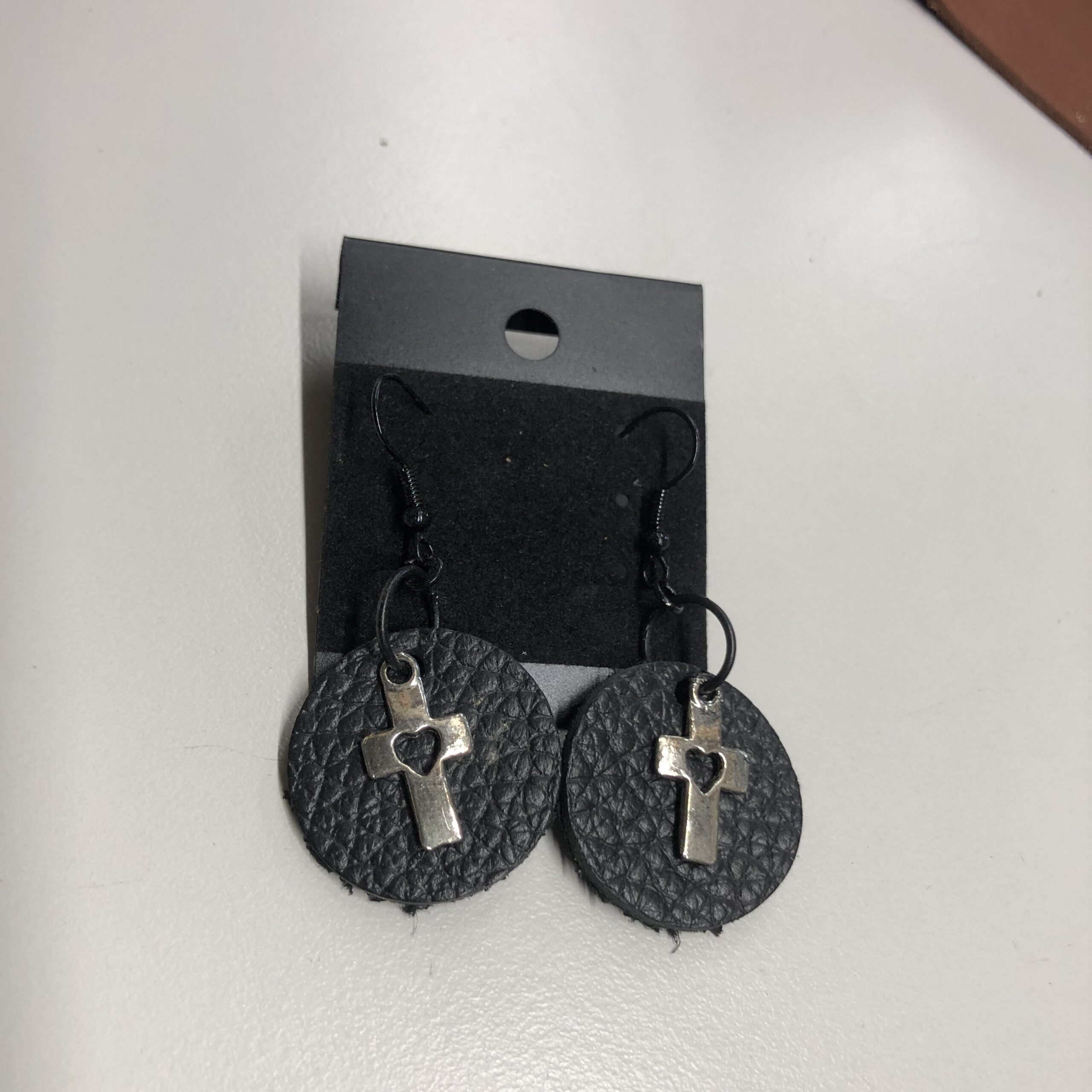 Real Black Pebbled Leather 1inch Round Earrings with Silver Heart Cutout Cross Charm on Black Ear Wires