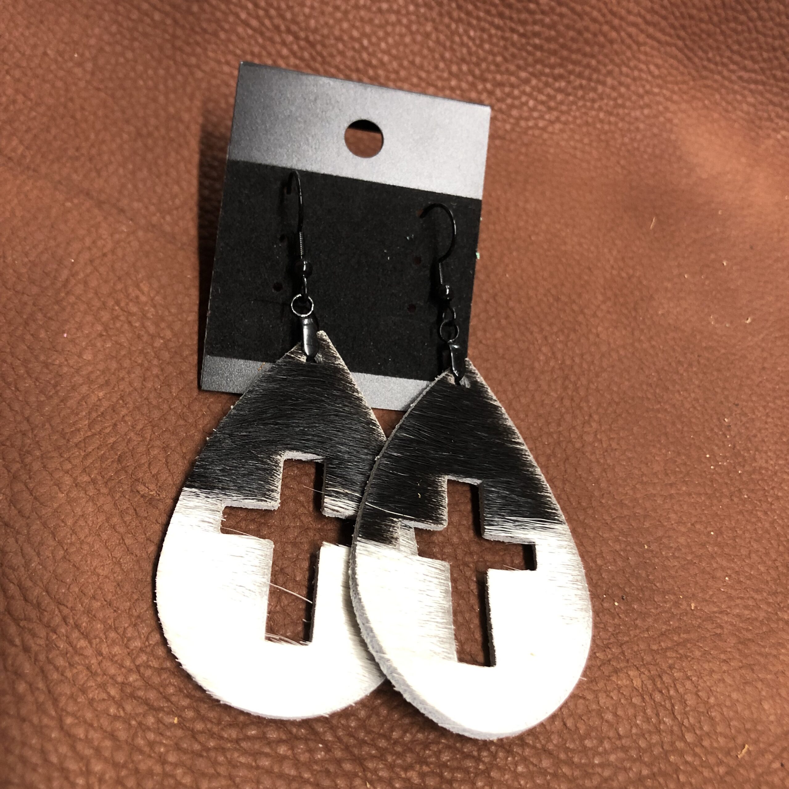 Real Hair on Hide Black & White Leather Cross Cutout Teardrop Earrings on Black Ear Wires