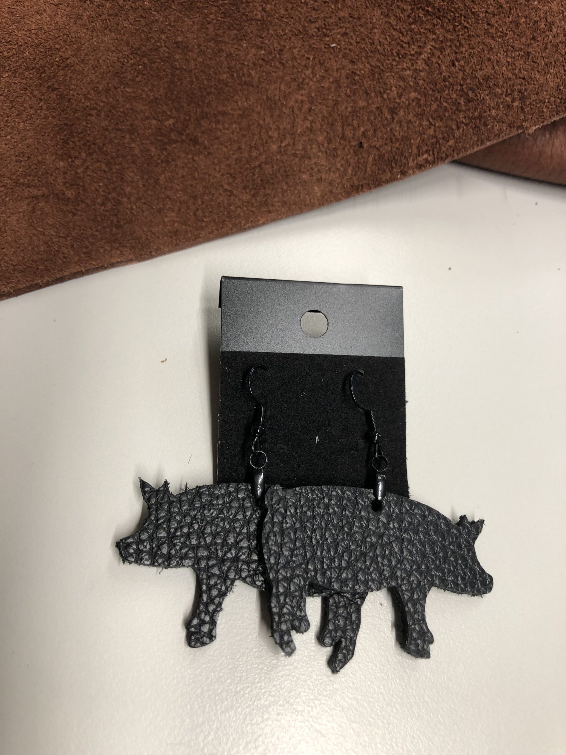 Real Black Pebbled Leather Pig Cutout Earrings on Black Ear Wires