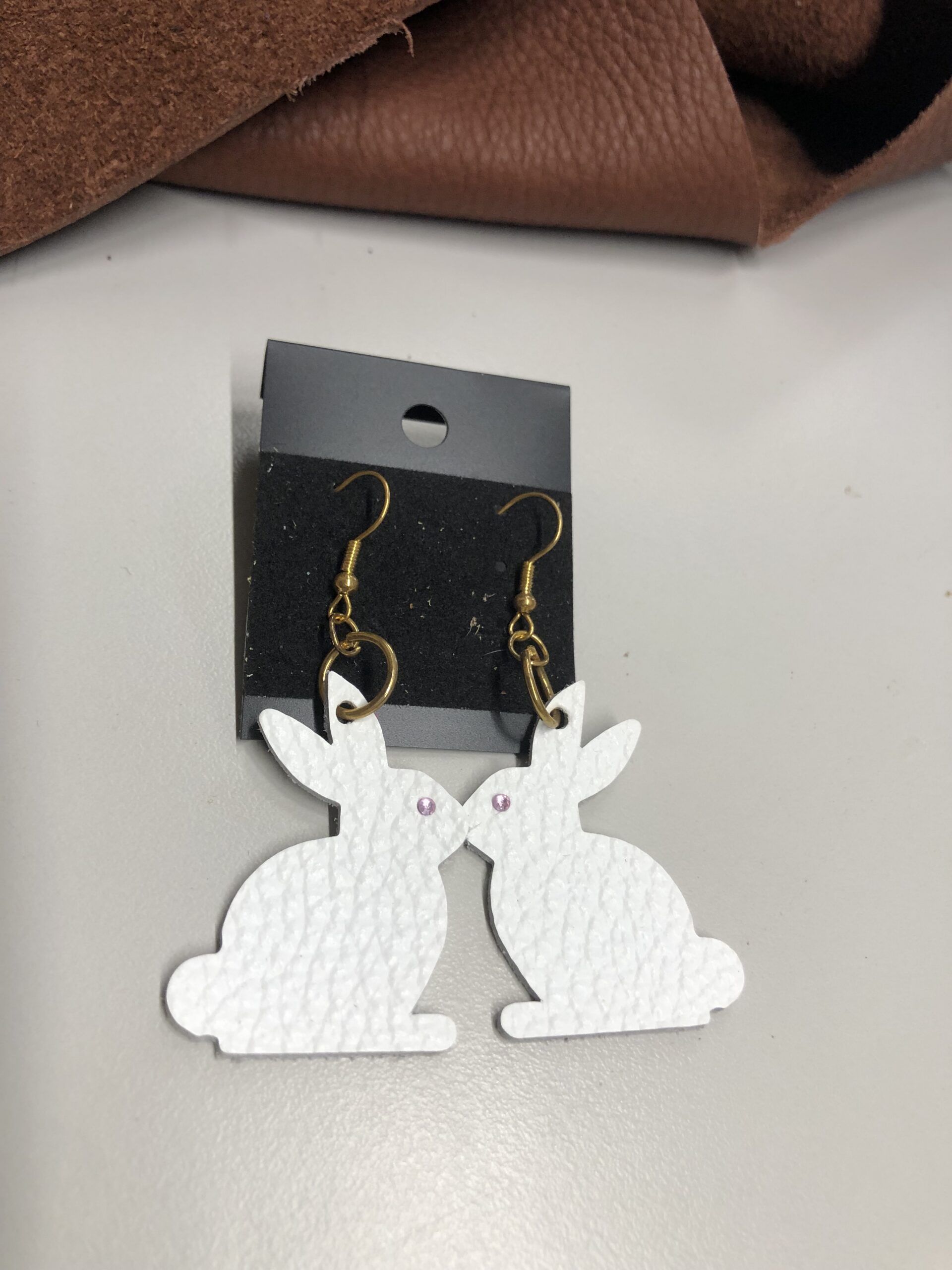 Real White Pebbled Leather Rabbit Cutout Earrings with Pink Rhinestone Eye on Gold Ear Wires